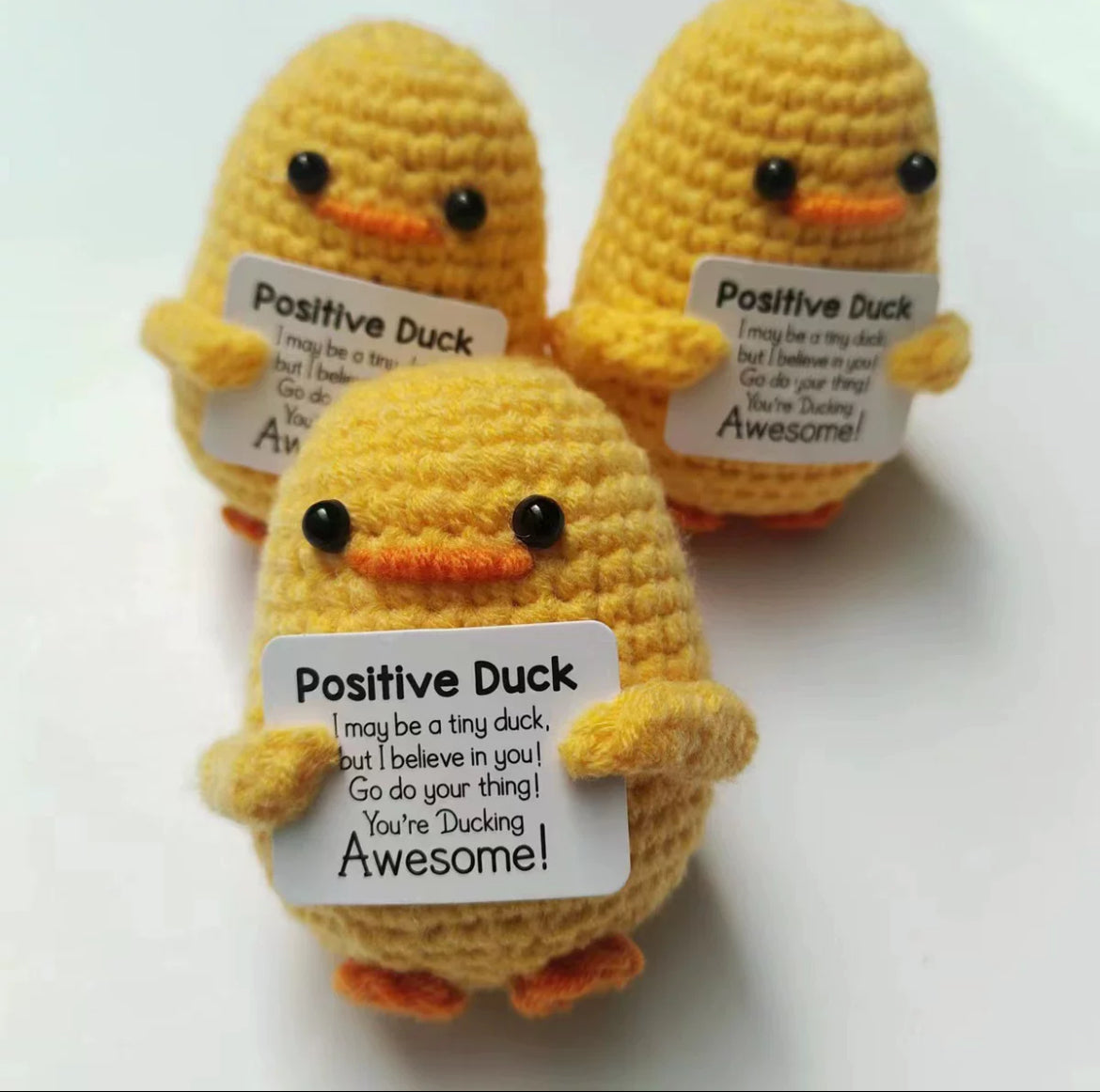 Crochet three small yellow ducks